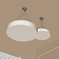 Two Modern Round White Pendant Lights Hanging From Ceiling For Home Interior Design