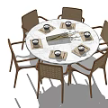 Stylish Dining Table Set With Round White Marble Top And Four Brown Woven Chairs