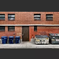 Urban Red Brick Building With Multiple Windows Wooden Door Blue Trash Bins And Graffiti Dumpsters