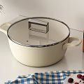 Cream Colored Casserole Pot with Lid Flour Package Green Plant Vegetable Print in Kitchen Setting
