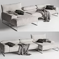 Light Gray Sectional Sofa With Black Pillows Gray Blanket And Metal Legs