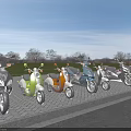 Colorful Motorcycles Parked in a Row Along Brick Roadside With Green Grass and Trees