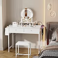 White Dressing Table With Round Mirror Drawers Stool Hair Dryer And Cosmetics In Bedroom