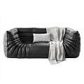 Black Leather Sectional Sofa With Padded Textured Design Light Blanket And Pillow