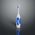 Electric Toothbrush With White And Blue Ergonomic Grip Handle And Soft Bristle Head
