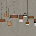 Multiple Pendant Lights With Various Colors And Shapes Hanging Against Light Colored Wall 3d model
