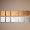 Gold and White Switch Panels Featuring Single Double Socket and Round Designs on Wall