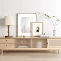 Modern Wooden TV Stand With Drawers Glass Doors Table Lamp Photo Frames And Green Plant