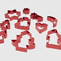 Red Cookie Cutters With Various Shapes Including Star Christmas Tree And Heart