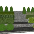 Neatly Trimmed Shrubs in Landscaped Garden with Stone Steps and Blue Sky