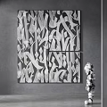 Black And White Abstract Painting With Four Panels On Gray Wall Near Sculpture