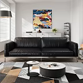 Black Leather Three Seater Sofa With Metal Legs In Modern Living Room With Abstract Art