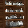 Wine Bottles and Glasses Neatly Displayed on Multiple Shelves in Wooden Cabinet