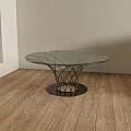 Modern Round Glass Top Coffee Table With Metal Mesh Base In Wooden Floor Room