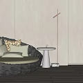 Dark Round Outdoor Chair with Hollow Design Light Cushions and Small Table in Minimalist Space