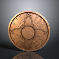 Ornate Round Bronze Shield with Intricate Patterns and Central Radiant Design