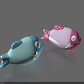 Blue And Pink Fish Shaped Toys With Star And Polka Dot Patterns And Eyes