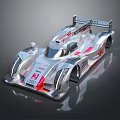 Sleek Silver Audi Race Car With Red Accents Rear Wing And Aerodynamic Design
