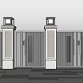 Modern Entrance Gate With Stone Pillars And Top Lanterns On Paved Ground