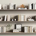 Organized Books and Magazines on Bookshelves with Decorative Vase Mugs and Sculpture