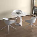 Modern White Round Meeting Table And Chairs By Window With City Sunset View