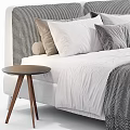 Modern Fabric Double Bed With Gray Pillows Striped Blanket And Side Table