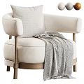 Beige Armchair With Rounded Armrests Wooden Legs And Gray Knitted Blanket