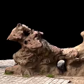 Rockery Stones With Natural Holes And Unique Shape On Brick Pavement With Grass