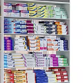 Multi Tiered Display Shelves Well Stocked With Various Packaged Goods In Retail Store