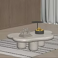 Irregular Marble Coffee Table with Cylindrical Legs Metal Bowl Fruits and Small Decorative Sculpture on Rug