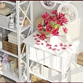 White Bathroom Cabinet With Decorative Mirror Red Flowers Towels And Storage Baskets