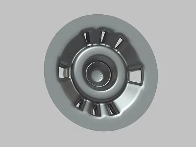 Silver Round Decorative Hubcap With Central Design And Peripheral Openings 3d model
