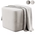 Light Gray Upholstered Ottoman with Soft Waffle Knit Blanket on Top
