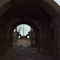 Ancient Stone Ruins With Arched Doorways And Overgrown Vines On Pathway