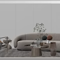 Modern Curved Sofa and Round Coffee Table Set with Green Plants Decorative Vases and Books