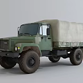 Military Green Truck with Canvas Covered Cargo Bed and Off-Road Exterior Design