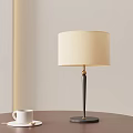 Modern Beige Lampshade Table Lamp With Dark Pole And White Cup On Table 3d model