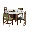 Round Wooden Table with Four Chairs Green Black Seats Round Back Holes Book Fruit Bowl