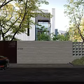 Modern Stone Building Exterior Wall With Black Gate Number 5-803 And Surrounding Trees Greenery