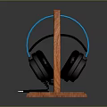 Stylish Wireless Headphones With Blue Headband And Black Earpads On Wooden Stand