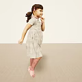 Little Girl Standing in Light Background Wearing Gray Dress Pink Socks and Pink Shoes