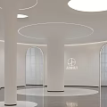 Modern Hotel Corridor With White Walls Round Pendant Lights Sleek Grey Flooring And Decorative Sculpture