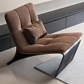 Brown Modern Lounge Chair With Soft Cushion And Black Legs On Gray Rug