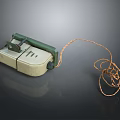 Vintage Household Sewing Machine with Green Presser Foot and Coiled Electric Cord