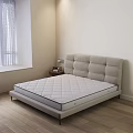 Double Bed With Light Beige Upholstered Headboard And Quilted Mattress Near Nightstand With Table Lamp