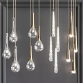 Multiple Illuminated Pendant Lights With Glass Teardrop And Metal Cylindrical Designs Hanging On Dark Background