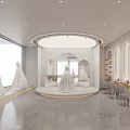 Elegant Wedding Dress Store Showcasing White Gowns On Round Platform With Mirrors And Makeup Stations