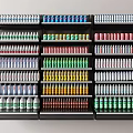 Neatly Arranged Display Shelves With Various Colored Bottles And Cans In Store