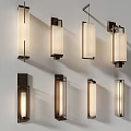 Contemporary Wall Sconces With Multiple Designs Illuminating White Wall In Stylish Home Decor