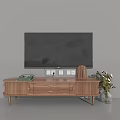 Wooden TV Stand with TV on Top Featuring Drawers Cabinet Doors Books and Potted Plants